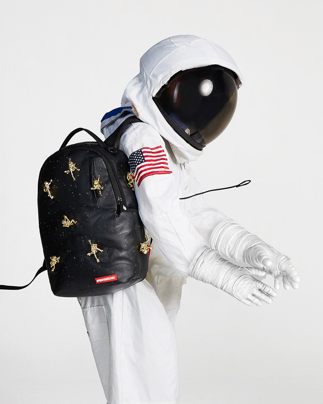 SPRAYGROUND THE LOST IN SPACE BACKPACK (10 3D GOLD METAL ASTRONAUTS)