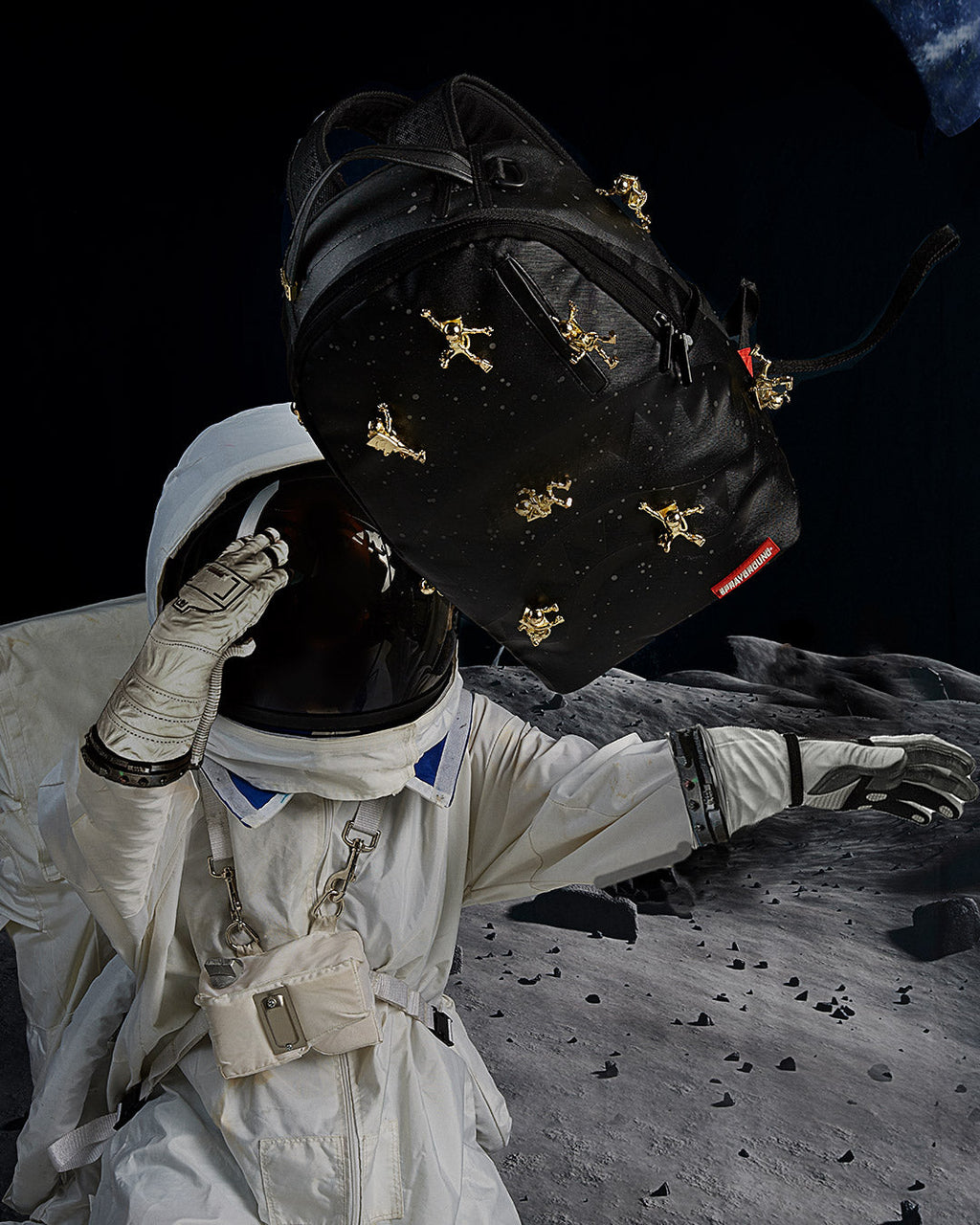 SPRAYGROUND THE LOST IN SPACE BACKPACK (10 3D GOLD METAL ASTRONAUTS)