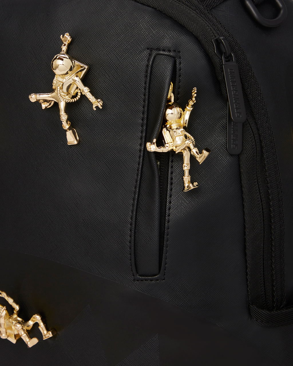 SPRAYGROUND THE LOST IN SPACE BACKPACK (10 3D GOLD METAL ASTRONAUTS)