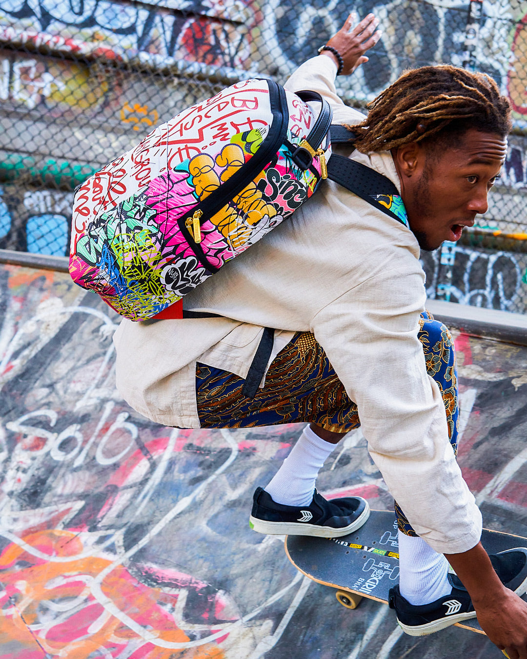 SPRAYGROUND TRI-SPLIT GRAFFITI BACKPACK (DLXV)