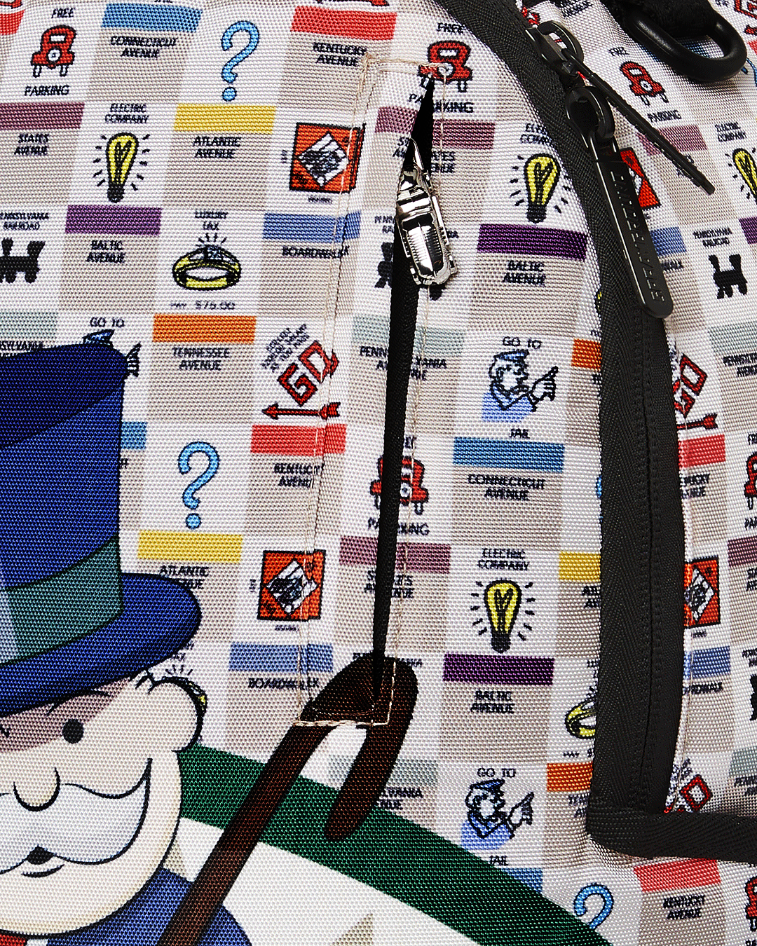 SPRAYGROUND MONOPOLY GOTTA GO DLXSR BACKPACK