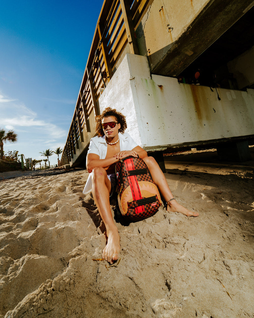 SPRAYGROUND HENNY VICTORY LAP SKATEBOARD-STRAP BACKPACK