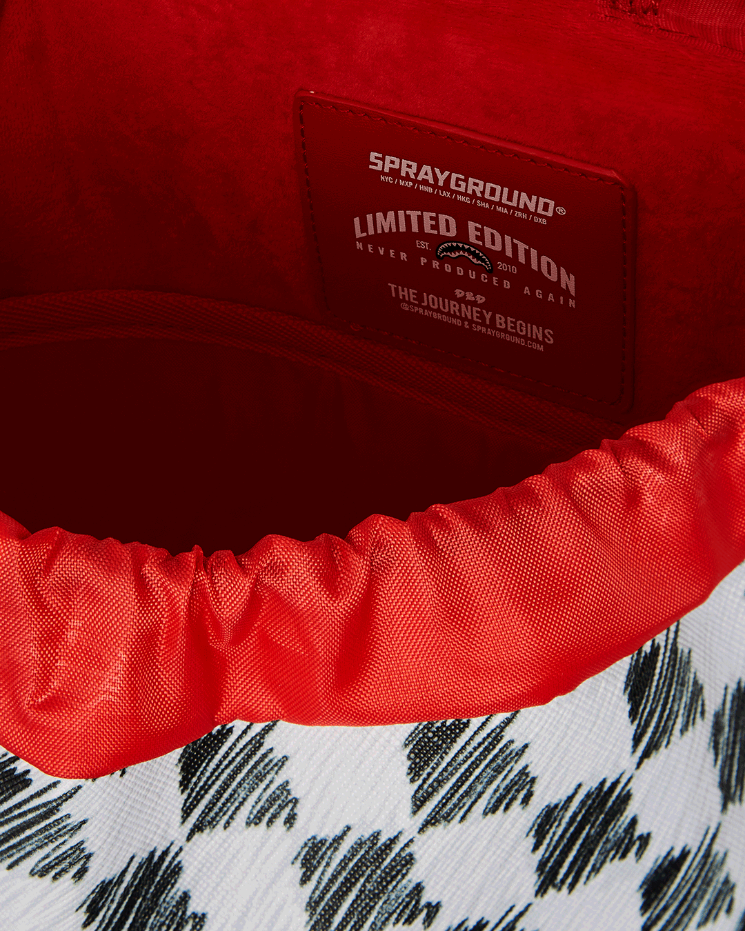 SPRAYGROUND SCRIBBLE DRIBBLE CHECK HILLS BACKPACK