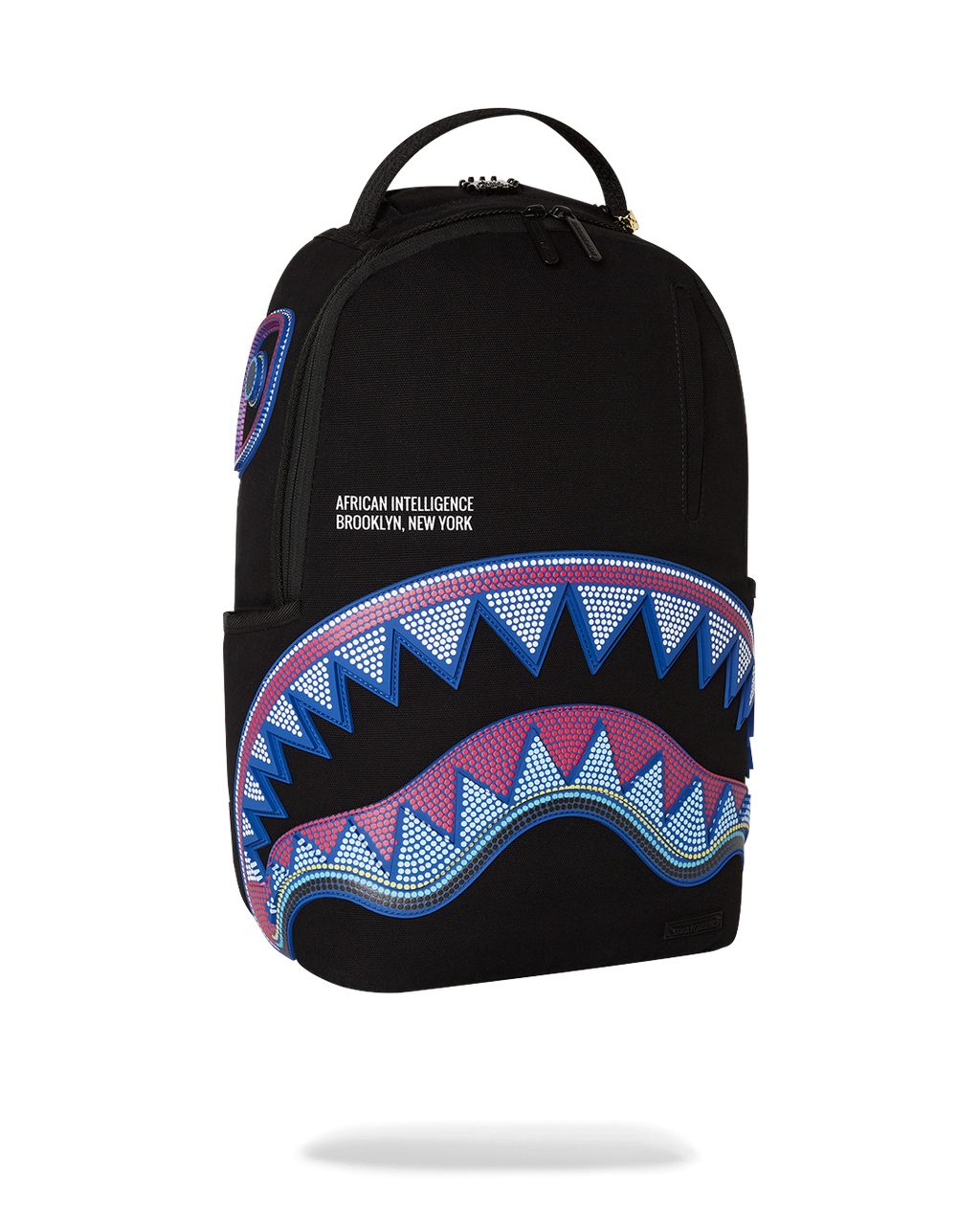 SPRAYGROUND A.I. AFRICAN INTELLIGENCE BORN AND RAISED BACKPACK - SANDFLOWER COLLAB