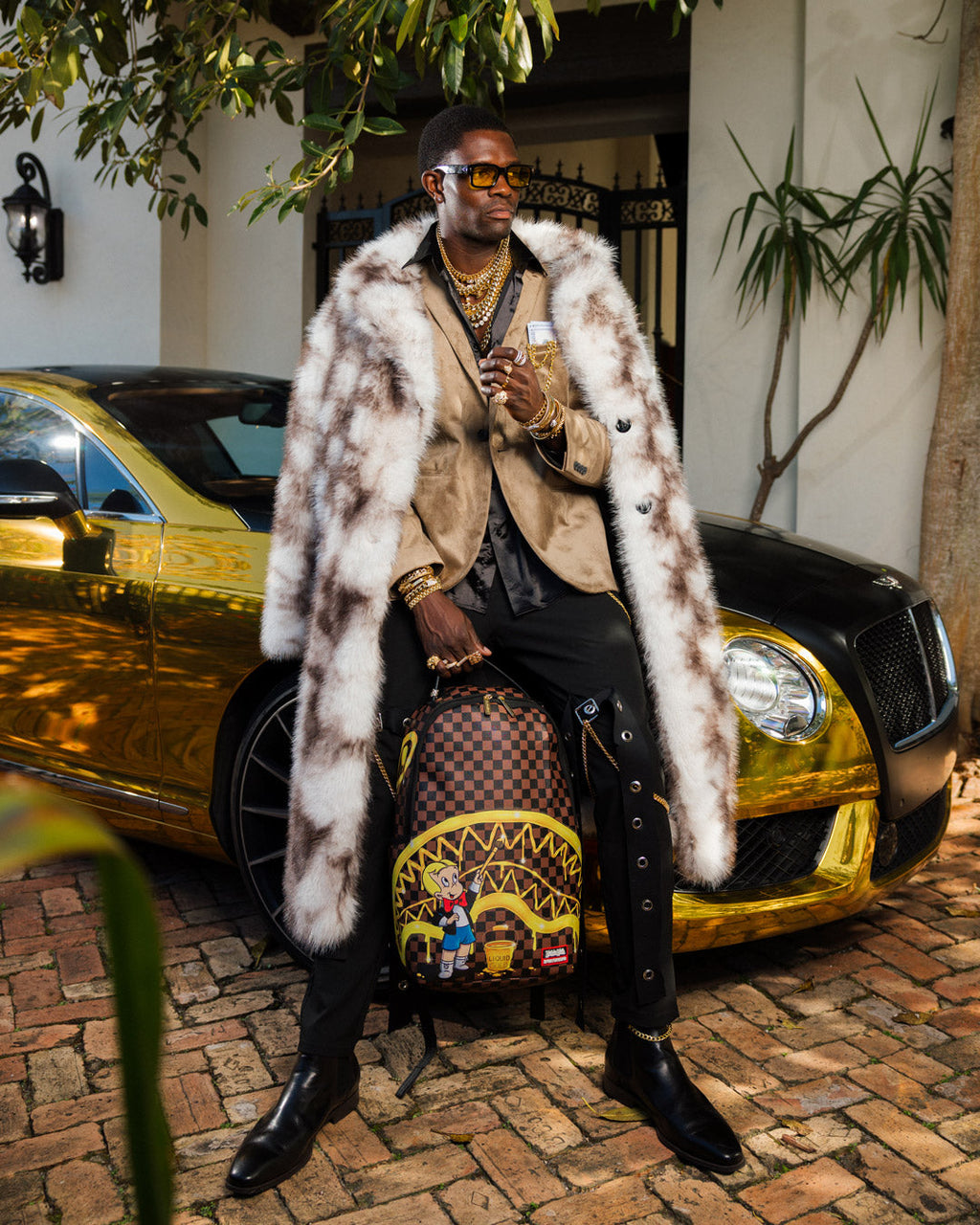 SPRAYGROUND RICHIE RICH PAINT THE SHARK GOLD BACKPACK