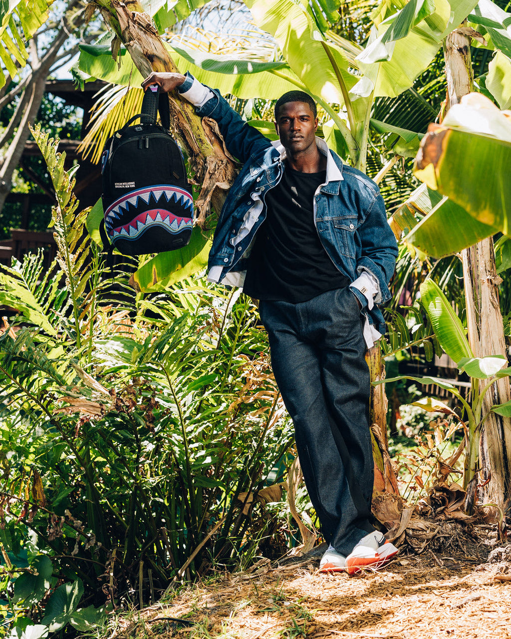 SPRAYGROUND A.I. AFRICAN INTELLIGENCE BORN AND RAISED BACKPACK - SANDFLOWER COLLAB