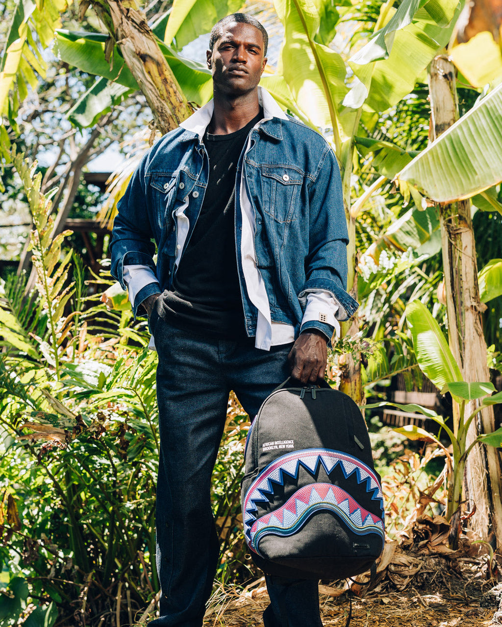 SPRAYGROUND A.I. AFRICAN INTELLIGENCE BORN AND RAISED BACKPACK - SANDFLOWER COLLAB
