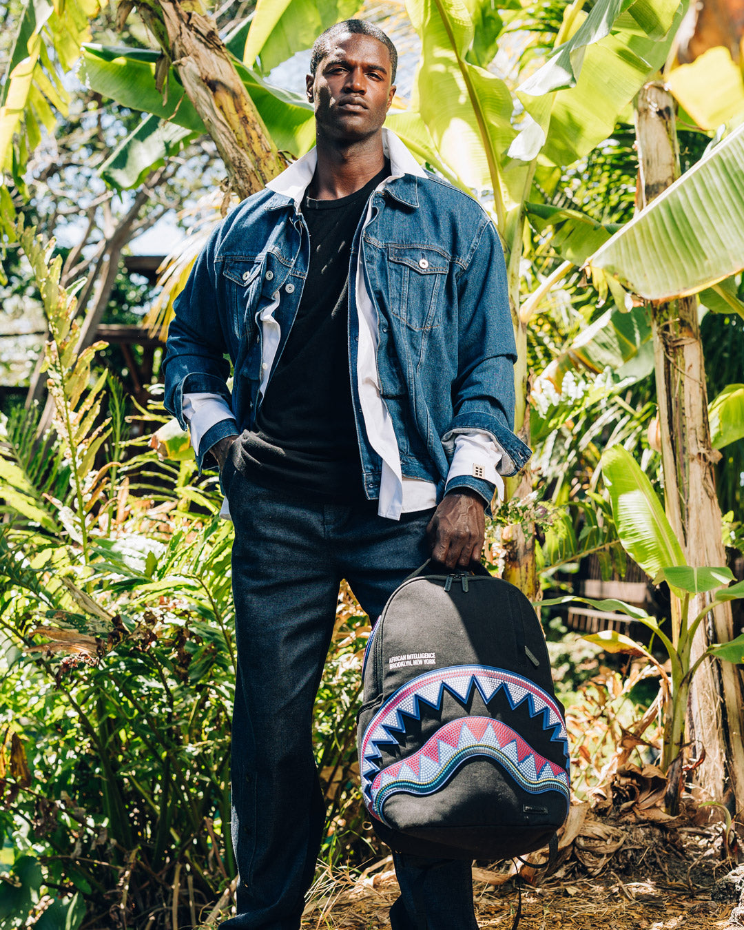 SPRAYGROUND A.I. AFRICAN INTELLIGENCE BORN AND RAISED BACKPACK - SANDFLOWER COLLAB